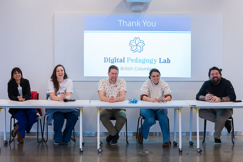 Five panelists sit behind a table at the Digital Pedagogy Lab. They are all smiling and the screen behind them says 'Thank You.'