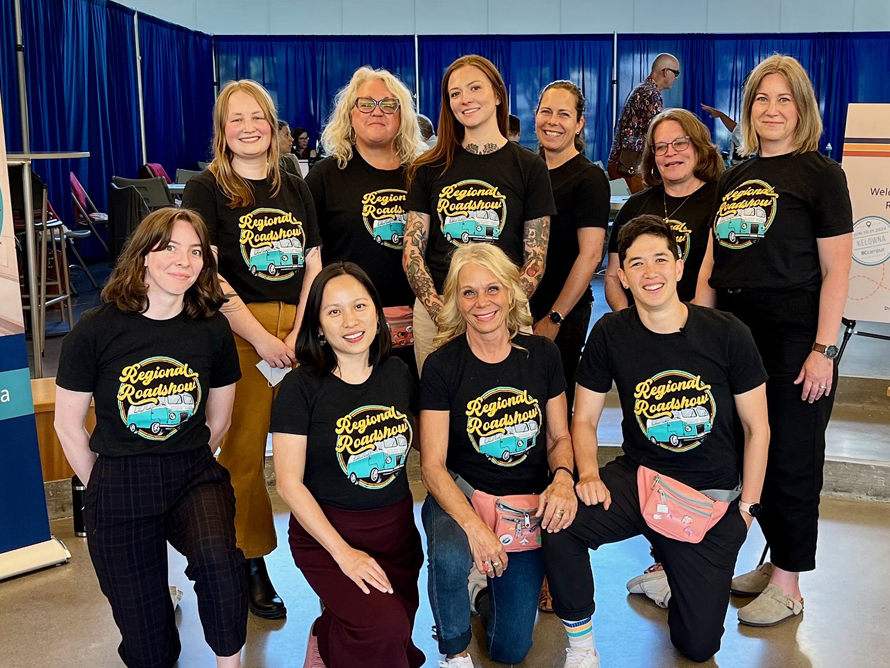 A group picture of the BCcampus roadshow crew wearing matching black Regional Roadshow t-shirts. There are 10 people, all smiling.
